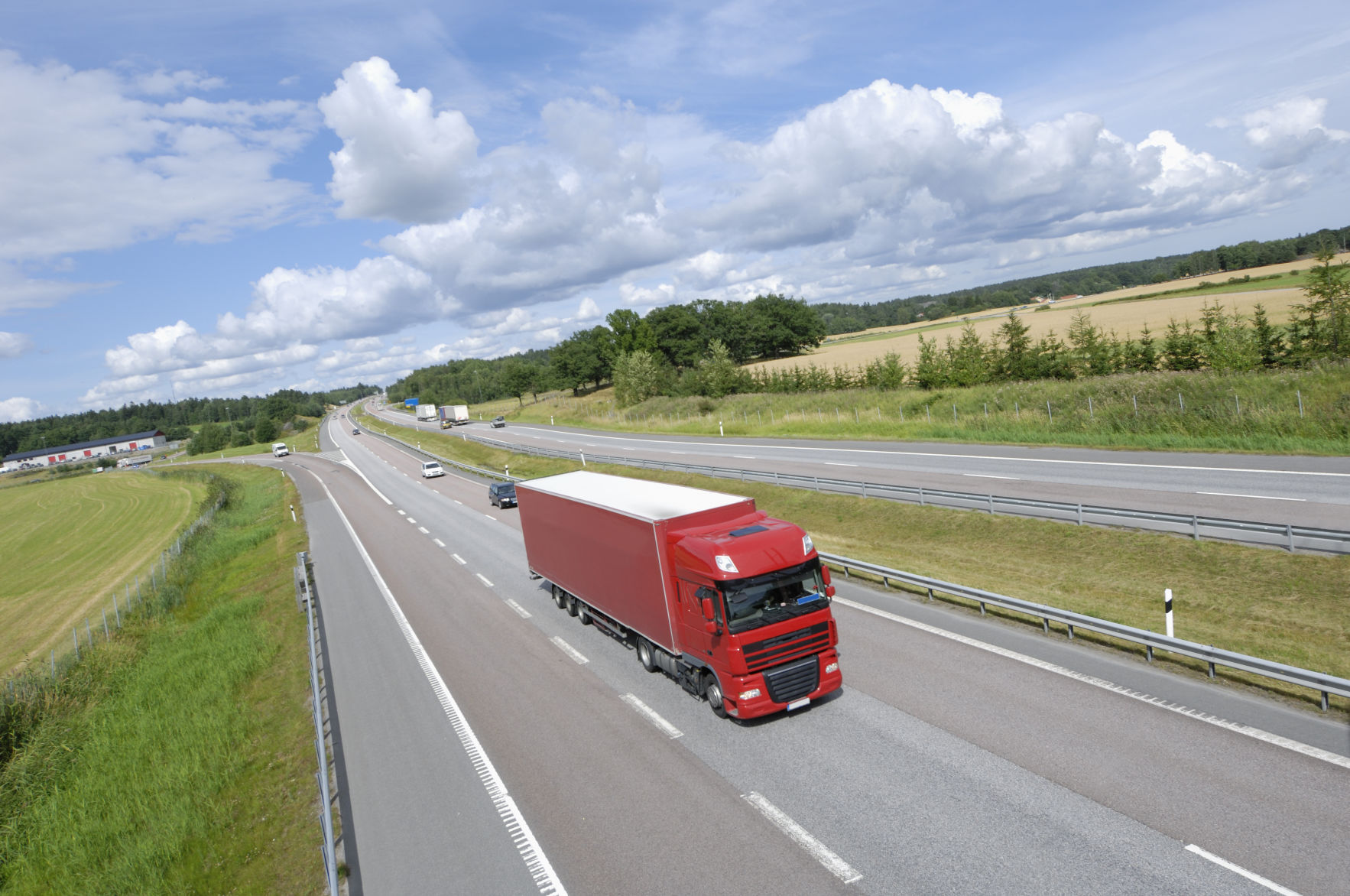 red truck driving on highway